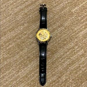 Gold watch with see through glass
